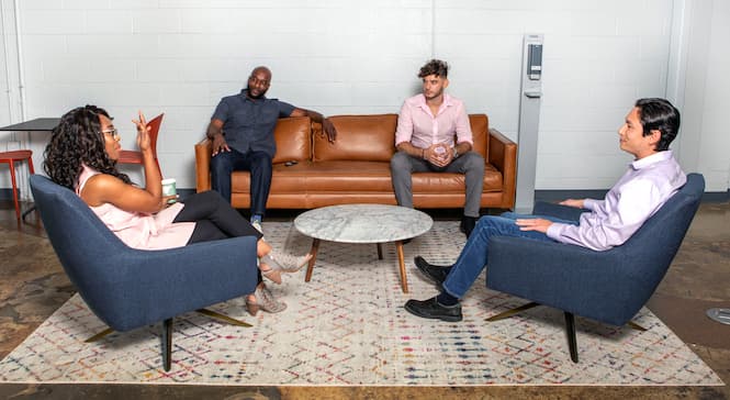 four people in conversation
